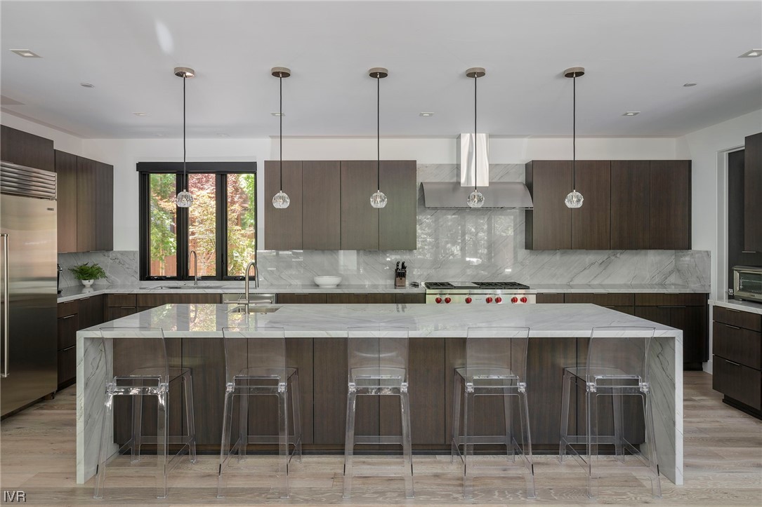 199 Tramway Road Incline Village, NV 89451 - Photo 9 of 49 a kitchen with kitchen island granite countertop a counter space cabinets and stainless steel appliances