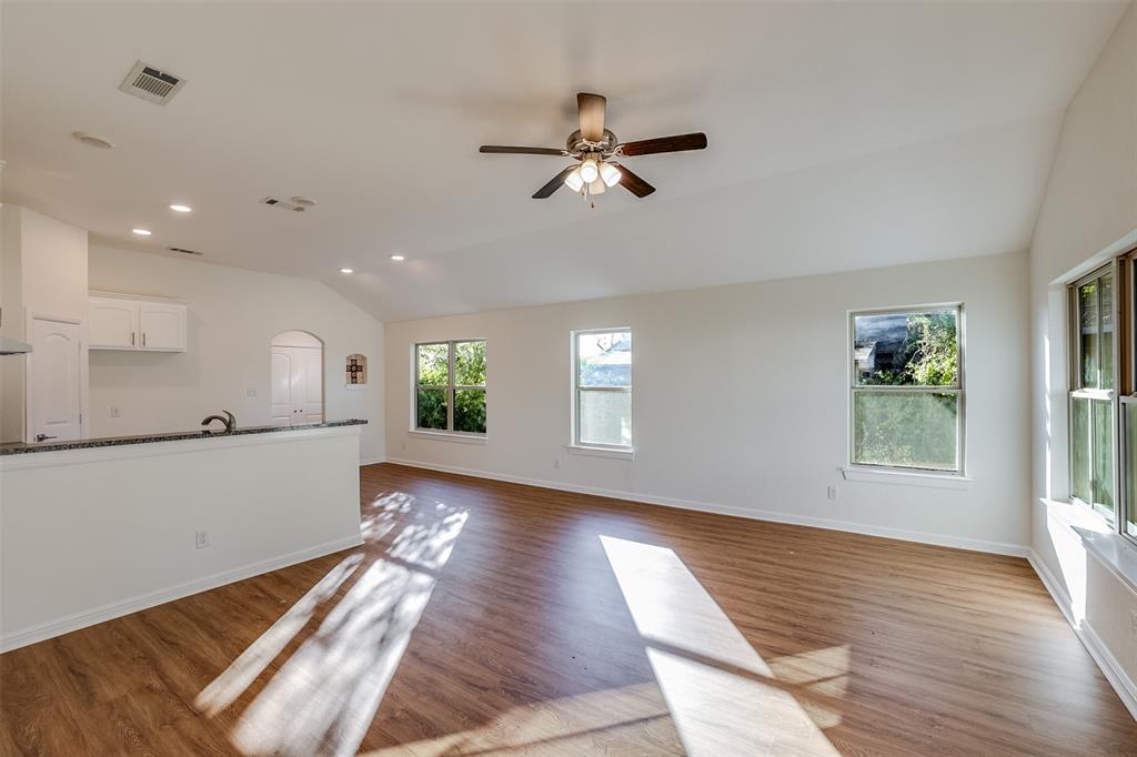 2836 Burchill Road South Fort Worth, TX 76105 - Photo 4 of 18 a view of empty room with wooden floor and window