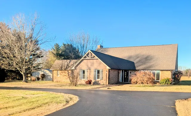 a view of a house with snow on the road