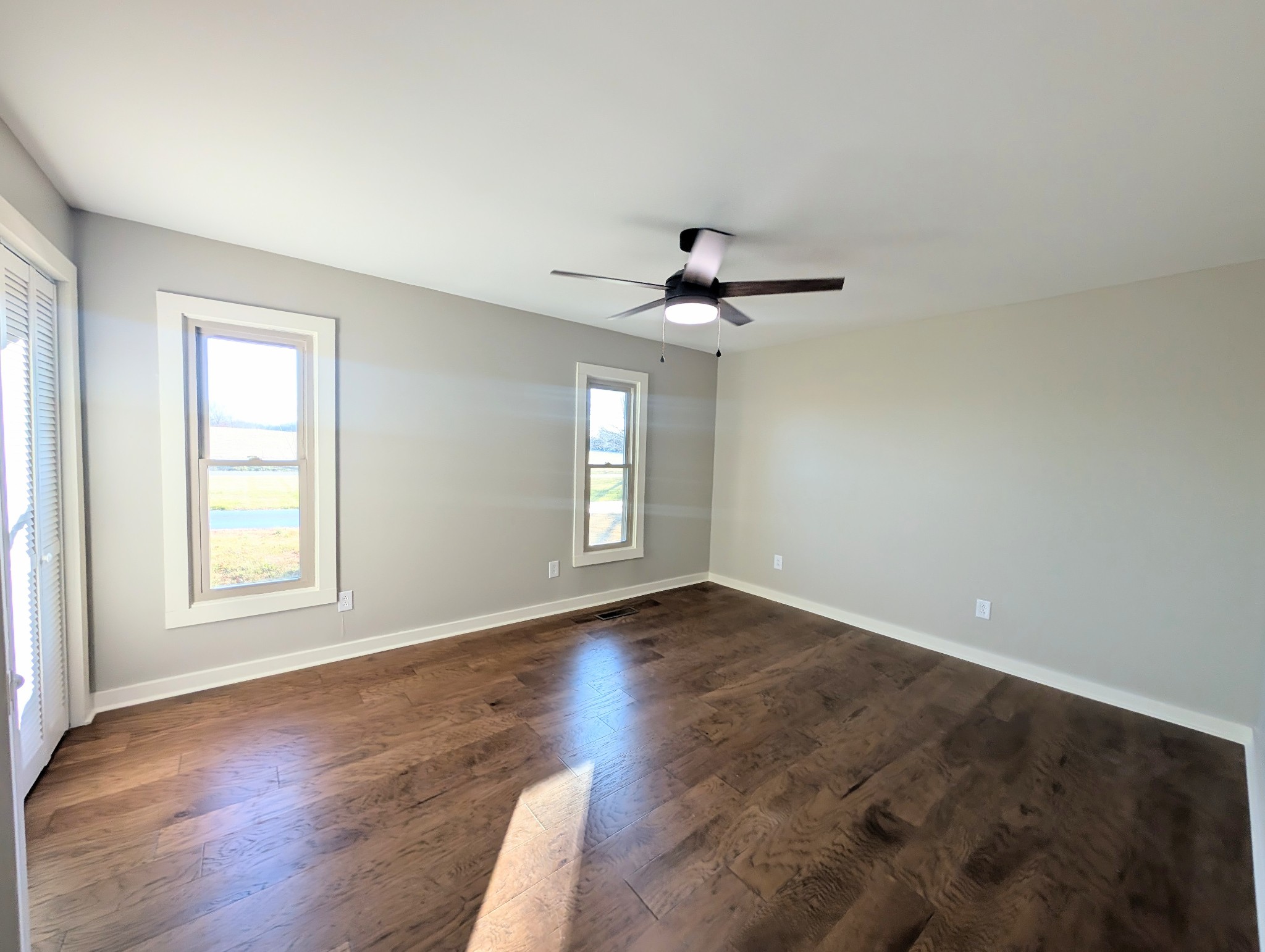 1080 Bybee Branch Road McMinnville, TN 37110 - Photo 13 of 36 a view of an empty room with a window and wooden floor