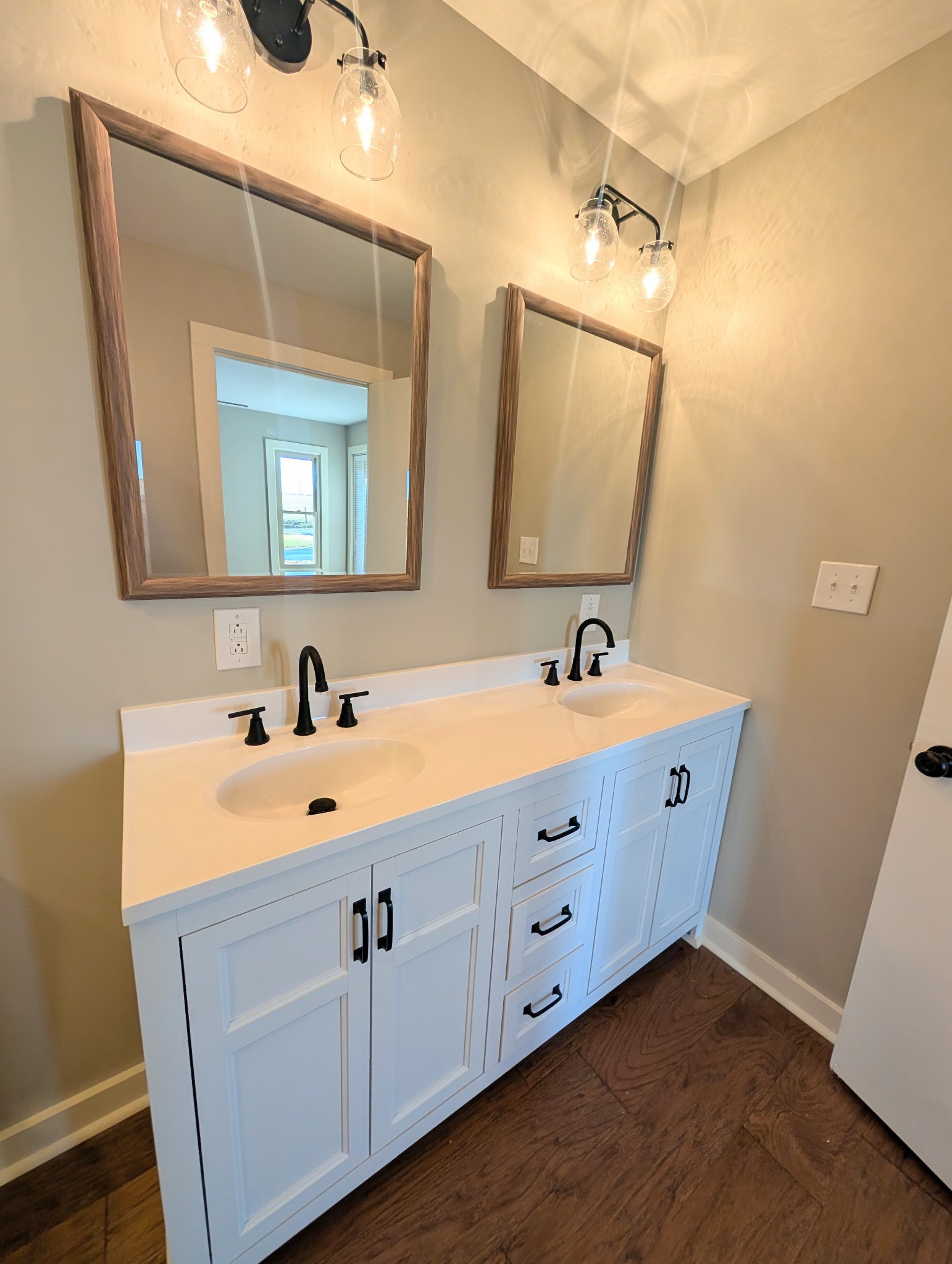 1080 Bybee Branch Road McMinnville, TN 37110 - Photo 15 of 36 a bathroom with a double vanity sink and mirror