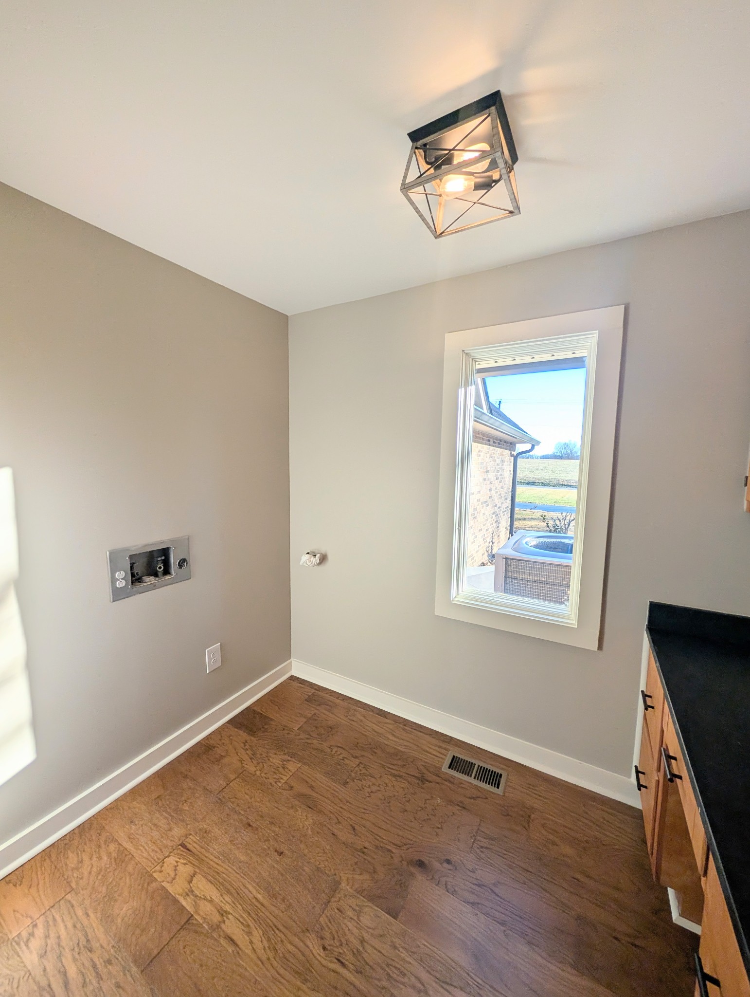 1080 Bybee Branch Road McMinnville, TN 37110 - Photo 27 of 36 a view of an empty room with wooden floor and a window