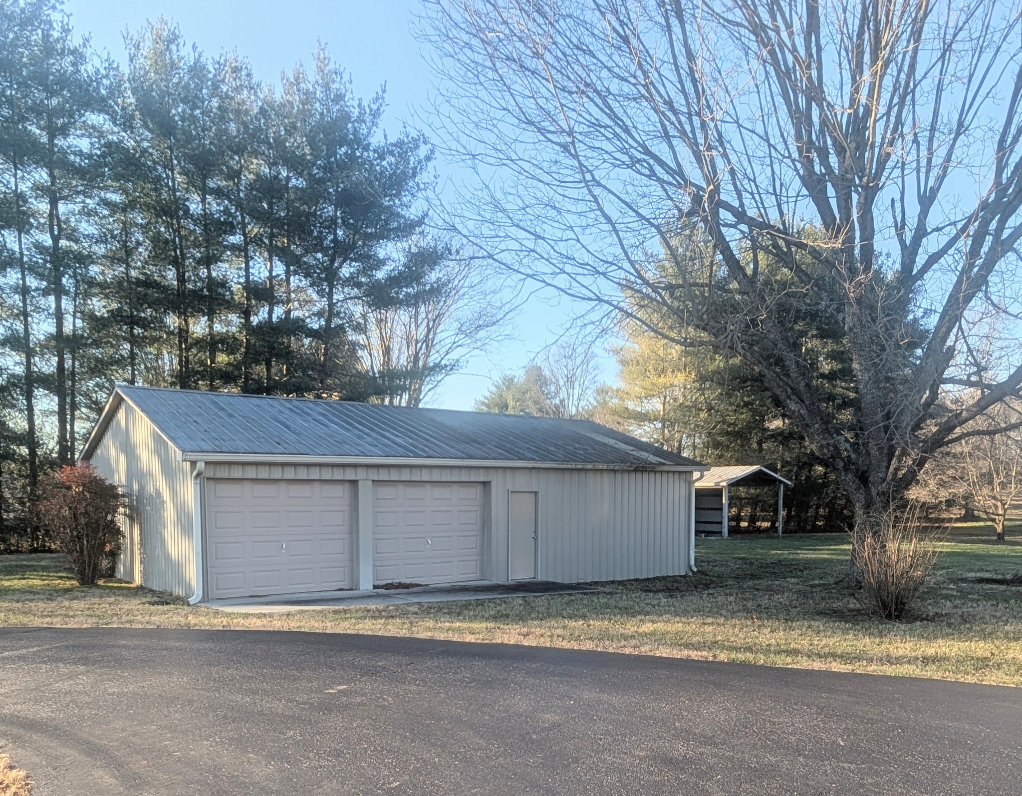 1080 Bybee Branch Road McMinnville, TN 37110 - Photo 32 of 36 a view of a house with a yard and large tree