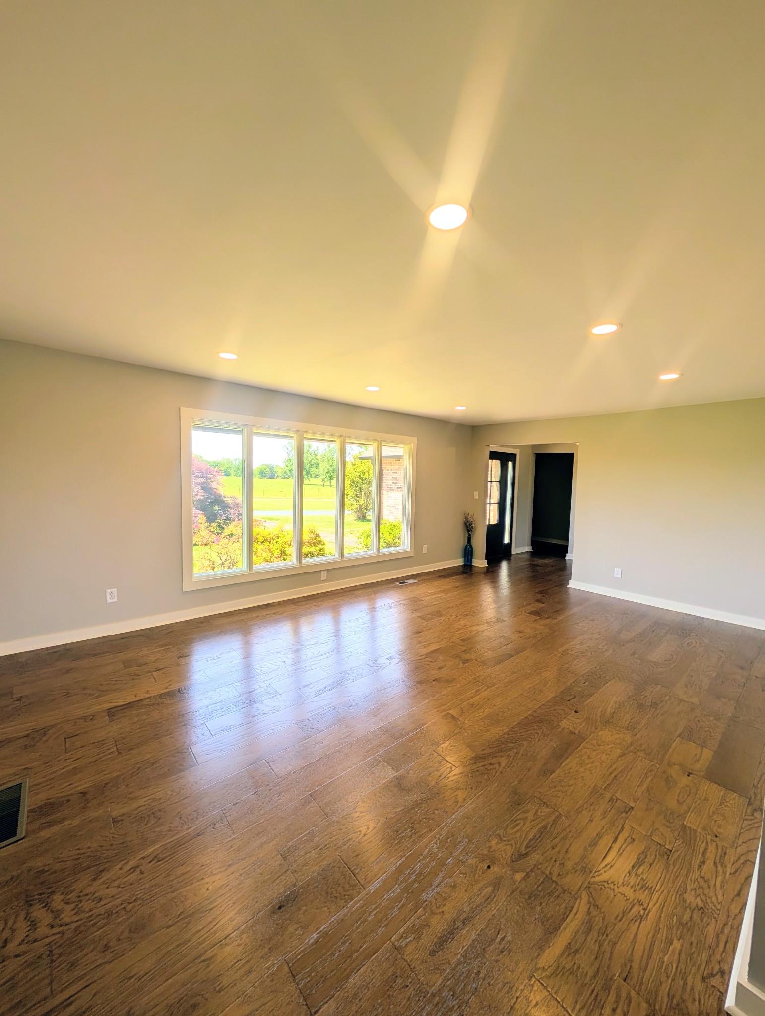 1080 Bybee Branch Road McMinnville, TN 37110 - Photo 5 of 52 a view of empty room with wooden floor and fan