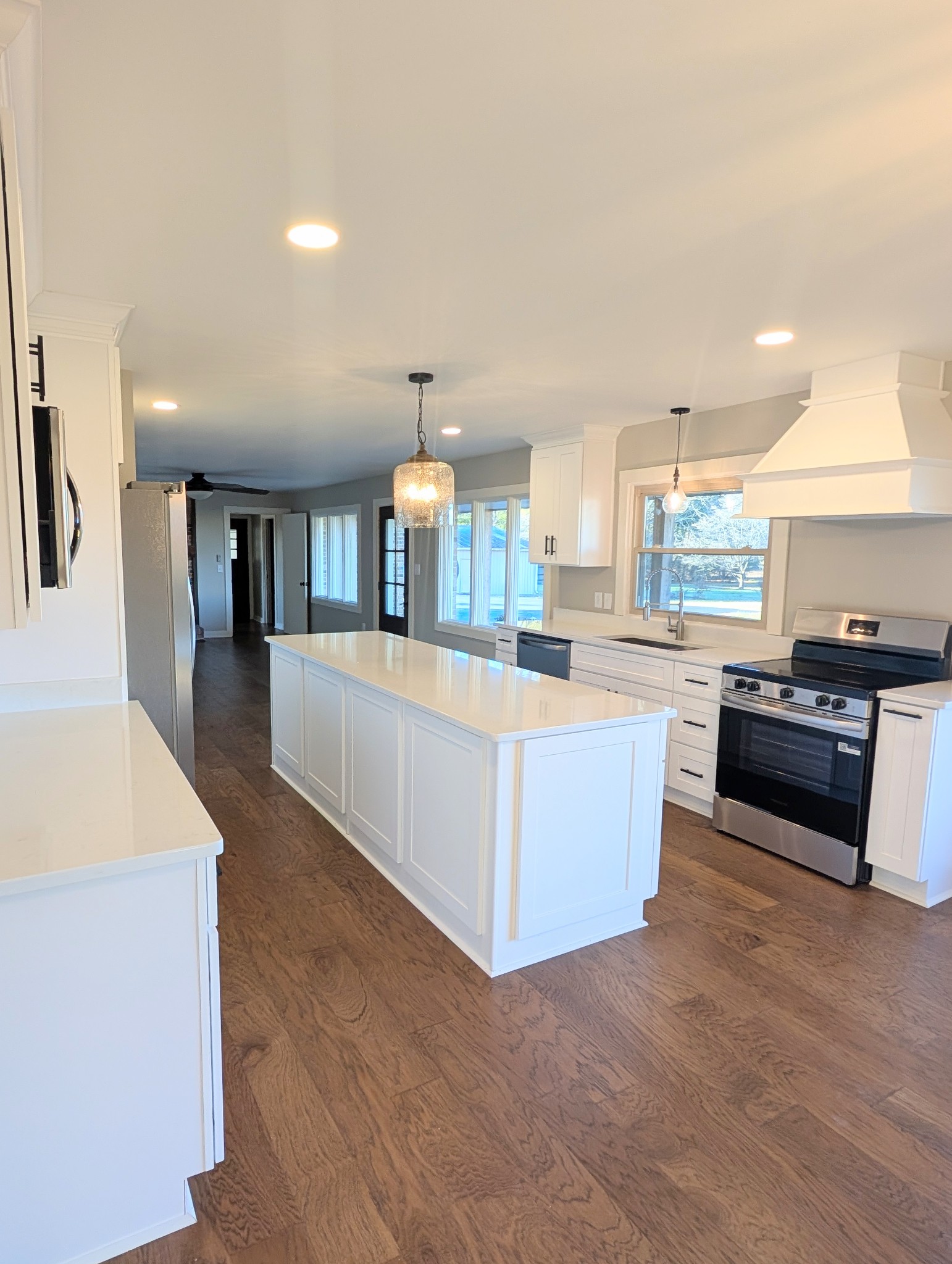 1080 Bybee Branch Road McMinnville, TN 37110 - Photo 5 of 36 a large kitchen with stainless steel appliances a large counter top a stove and a refrigerator