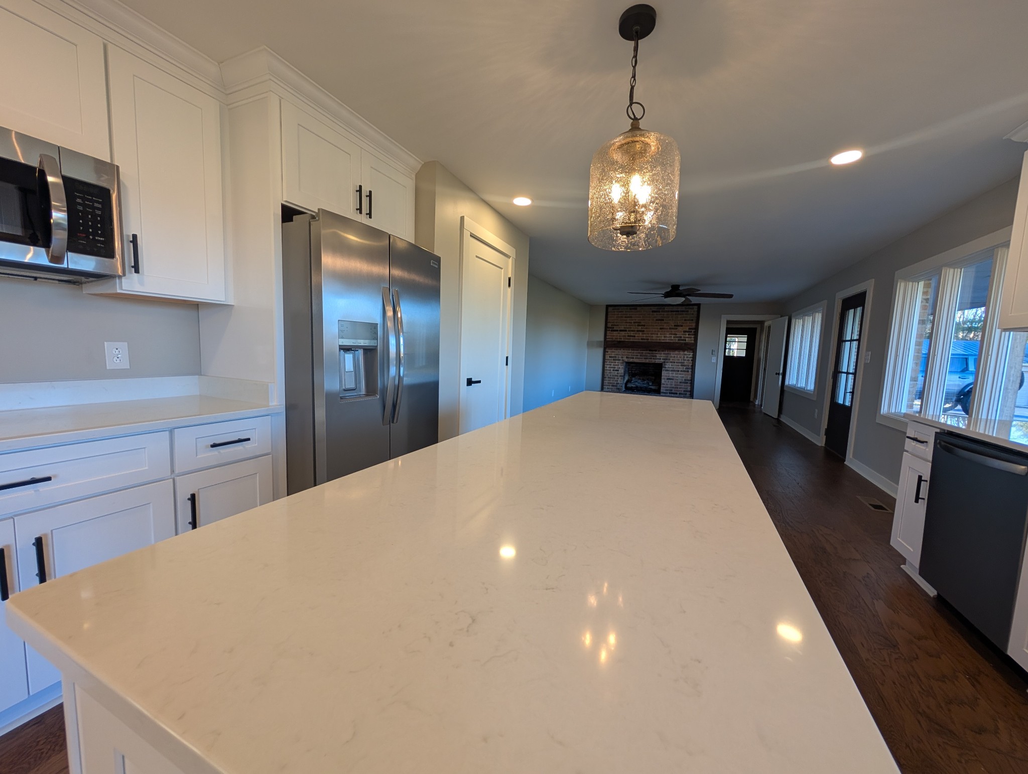 1080 Bybee Branch Road McMinnville, TN 37110 - Photo 6 of 36 a large kitchen with stainless steel appliances a chandelier