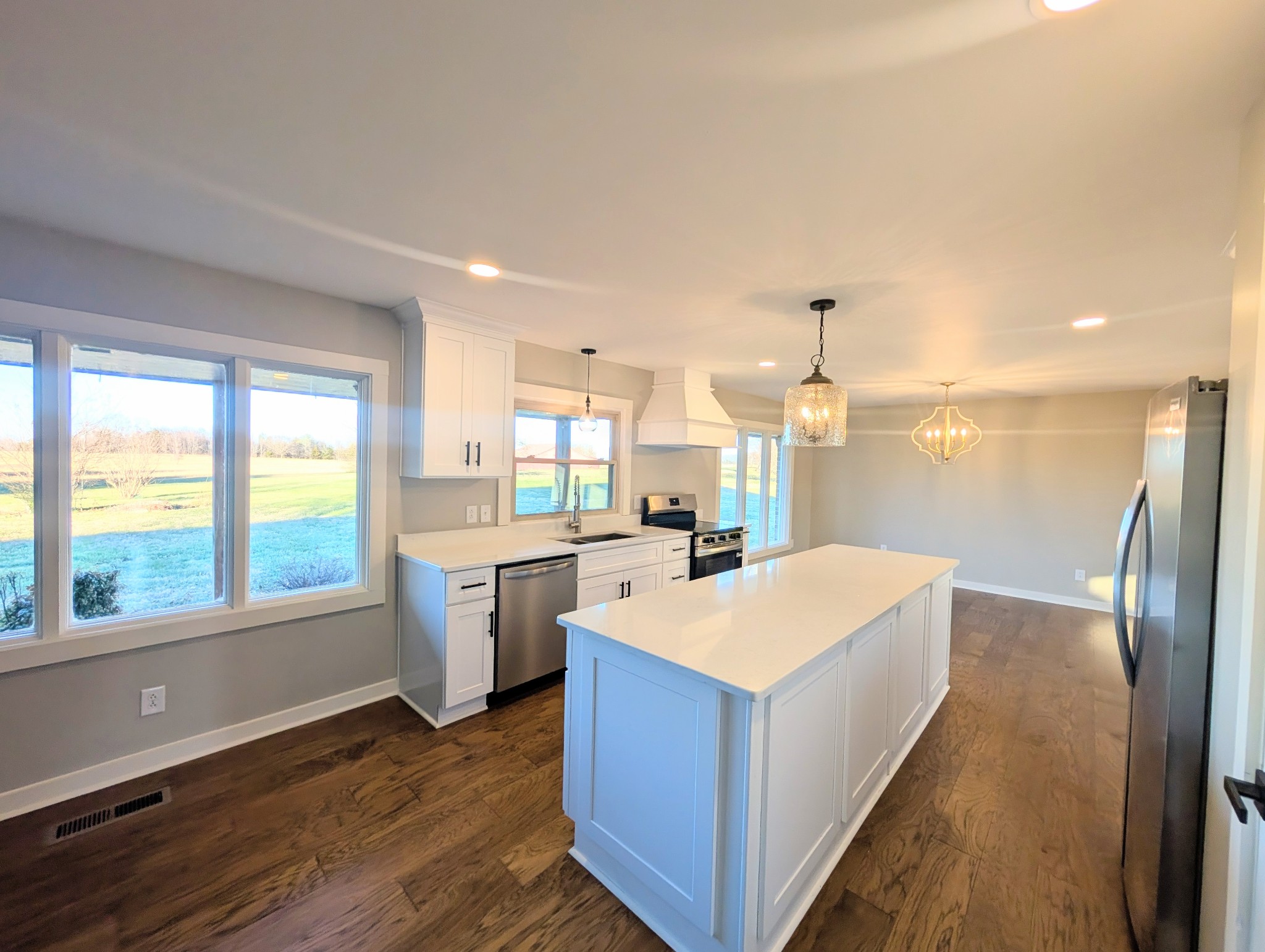 1080 Bybee Branch Road McMinnville, TN 37110 - Photo 7 of 36 a large kitchen with a large counter top a sink a window and stainless steel appliances