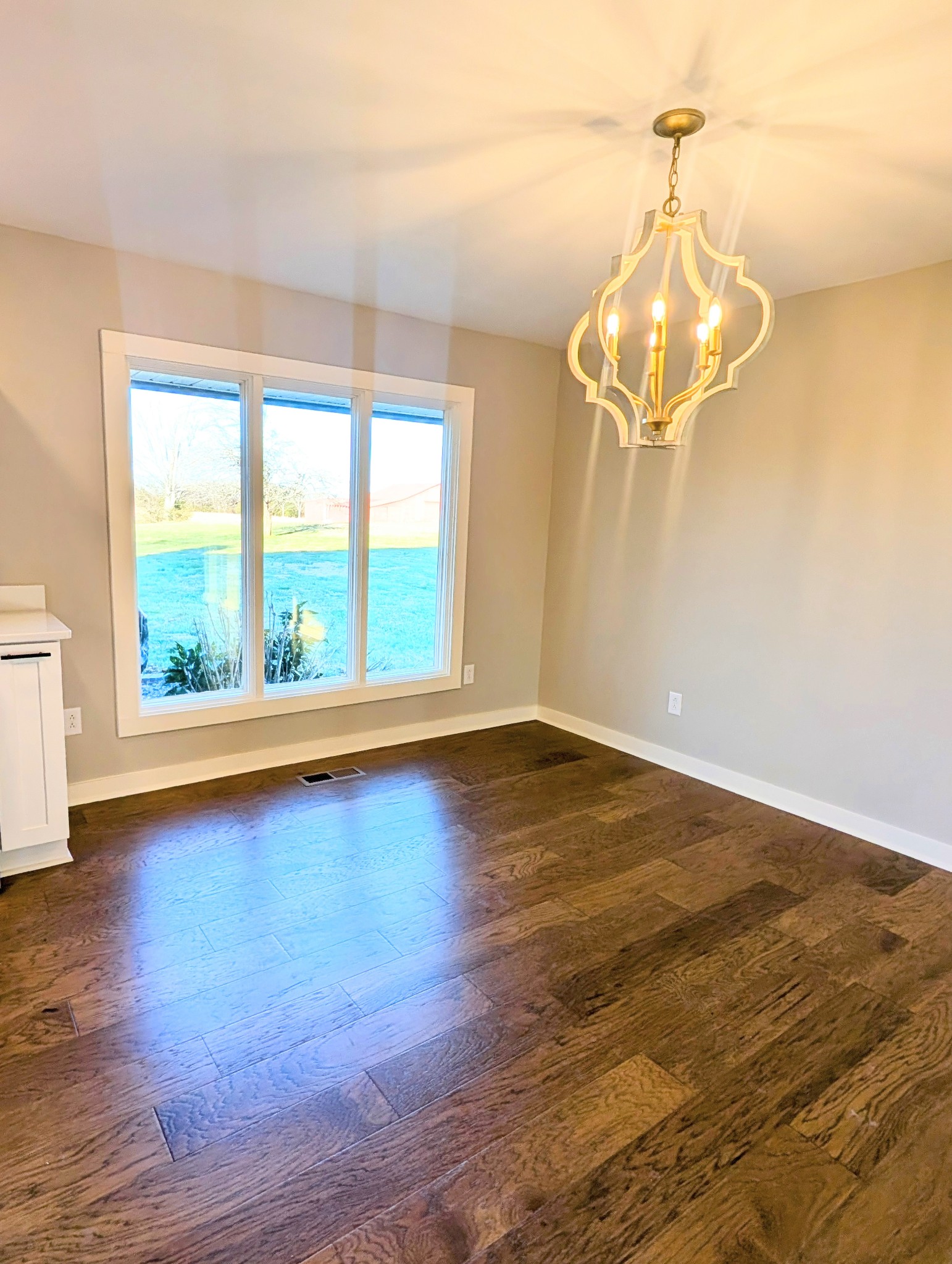 1080 Bybee Branch Road McMinnville, TN 37110 - Photo 9 of 36 a view of a room with wooden floor and large windows