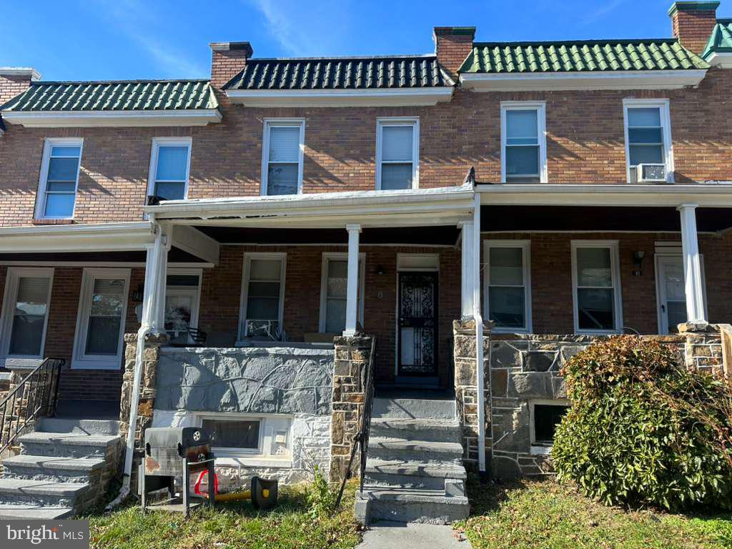 8 North Ellamont Street Baltimore, MD 21229 - Photo 2 of 16 front view of a house with a porch