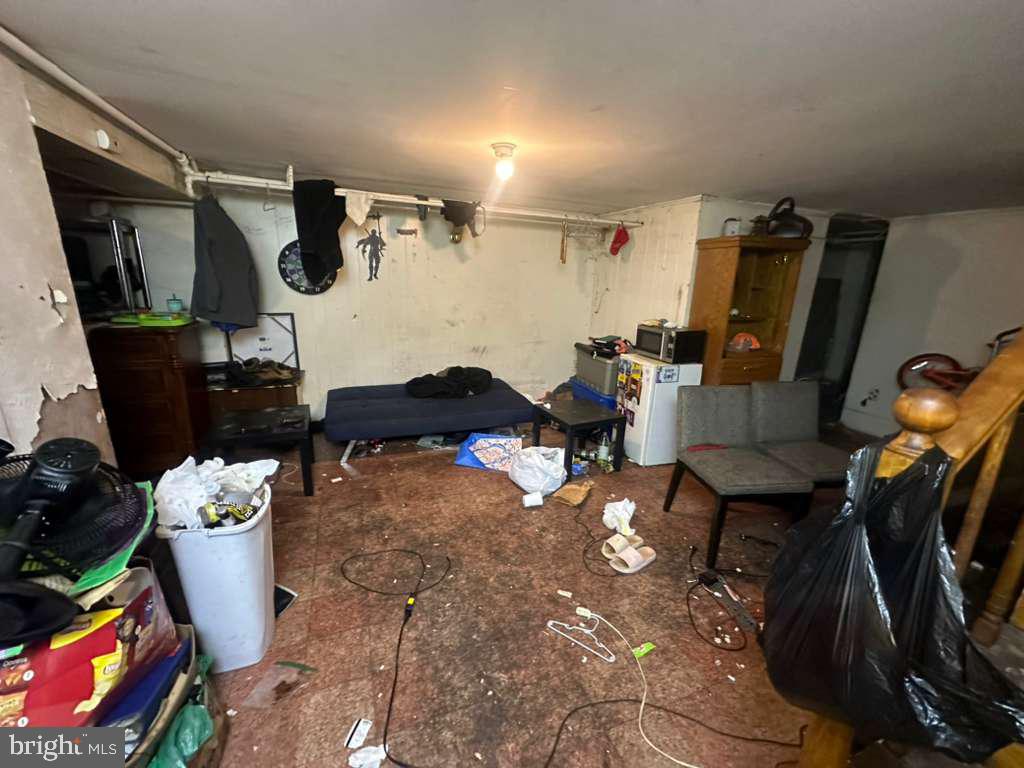 8 North Ellamont Street Baltimore, MD 21229 - Photo 3 of 16 a living room with furniture and a window