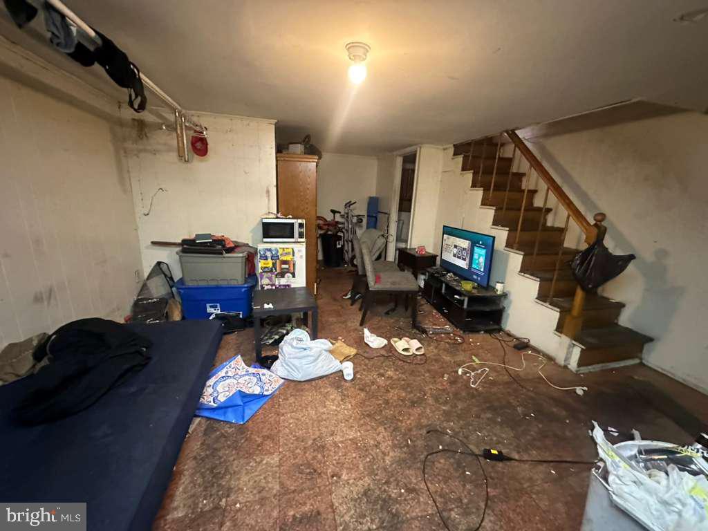 8 North Ellamont Street Baltimore, MD 21229 - Photo 4 of 16 a living room with furniture and a chandelier