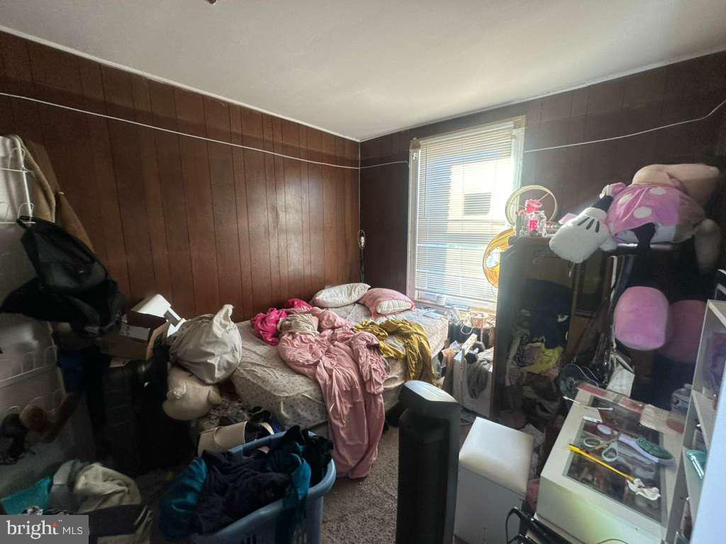 8 North Ellamont Street Baltimore, MD 21229 - Photo 8 of 16 a bedroom with bed and a closet