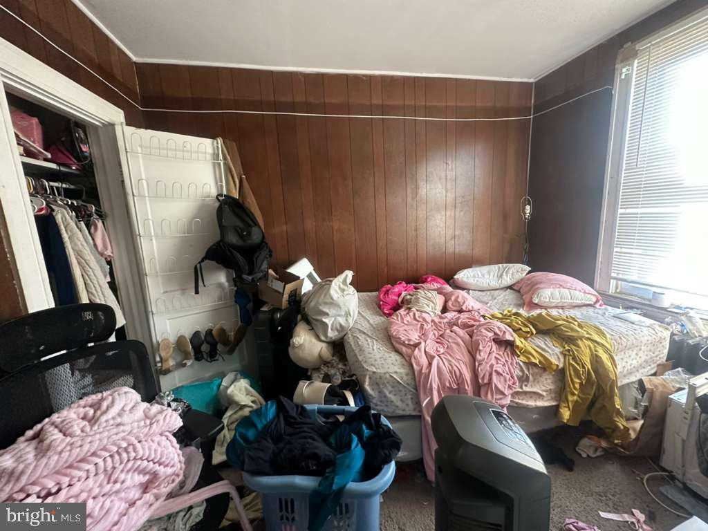 8 North Ellamont Street Baltimore, MD 21229 - Photo 9 of 16 a bedroom with a bed and a window