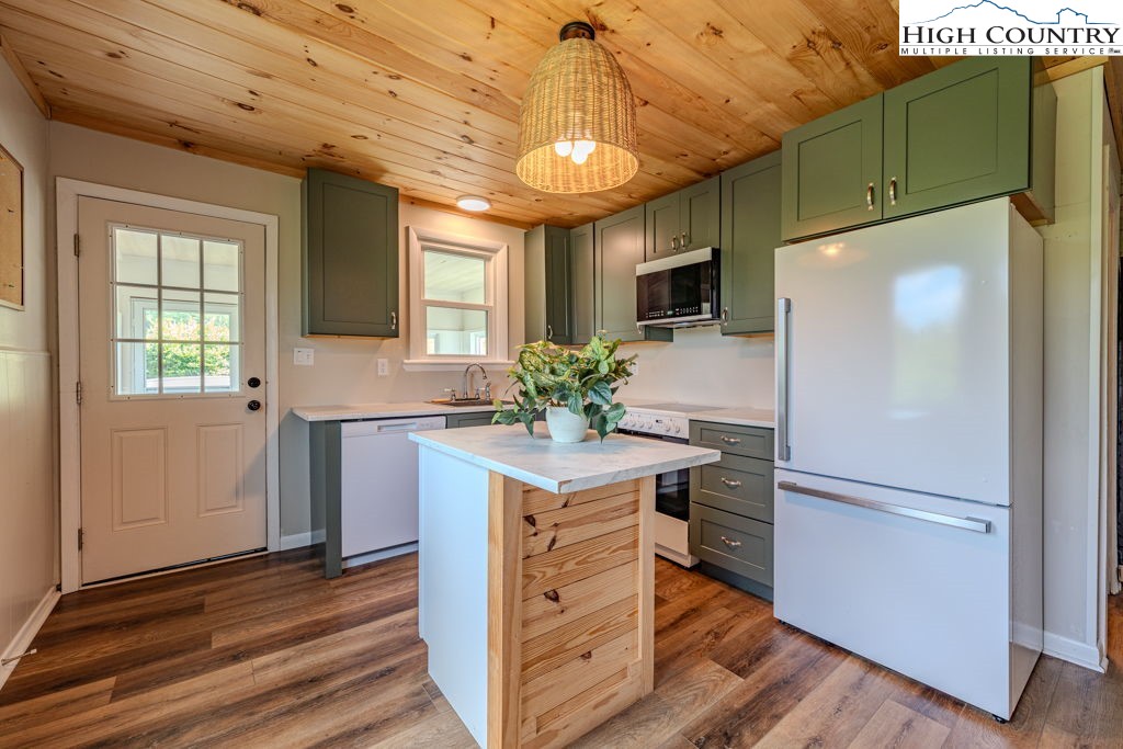 1821 Deerfield Road Boone, NC 28607 - Photo 13 of 33 a kitchen with a refrigerator and a sink