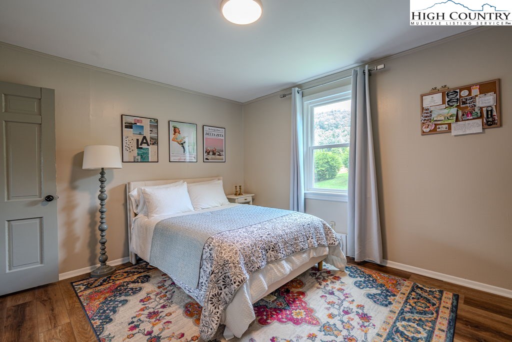 1821 Deerfield Road Boone, NC 28607 - Photo 20 of 33 a bedroom with a bed and a window
