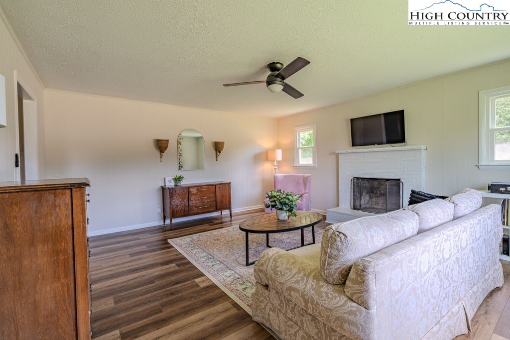 1821 Deerfield Road Boone, NC 28607 - Photo 24 of 33 a living room with furniture and a fireplace