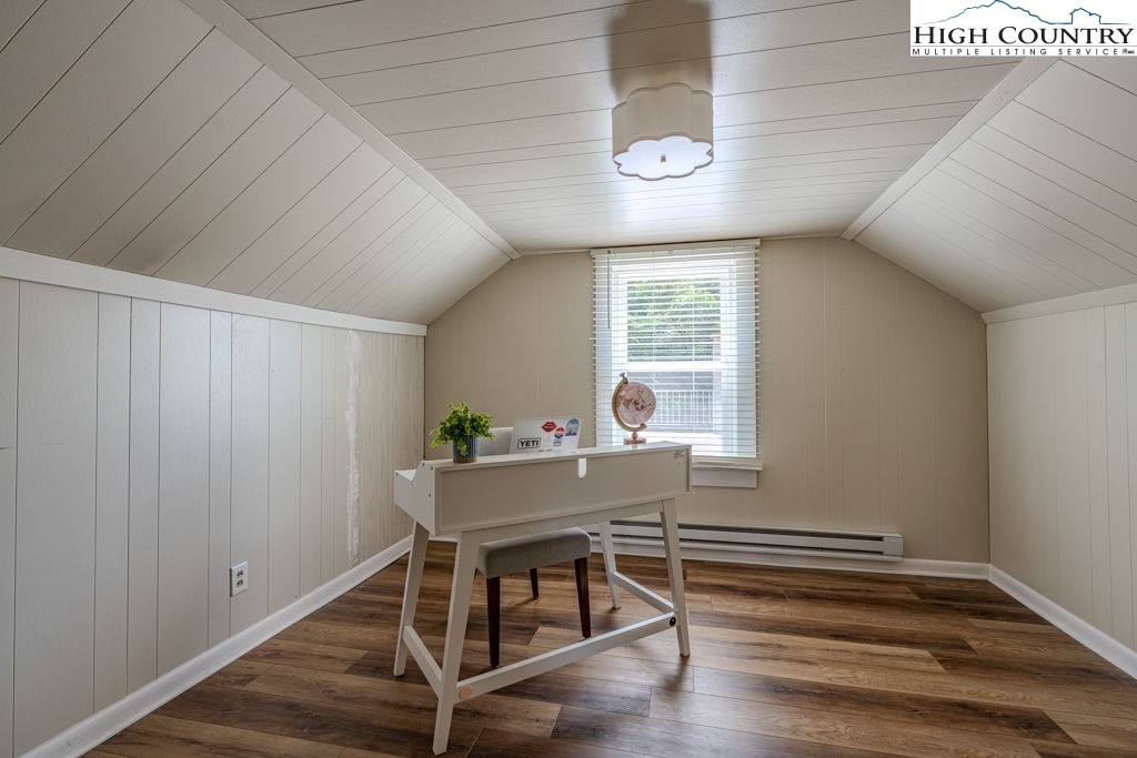 1821 Deerfield Road Boone, NC 28607 - Photo 30 of 33 a room with wooden floor and windows