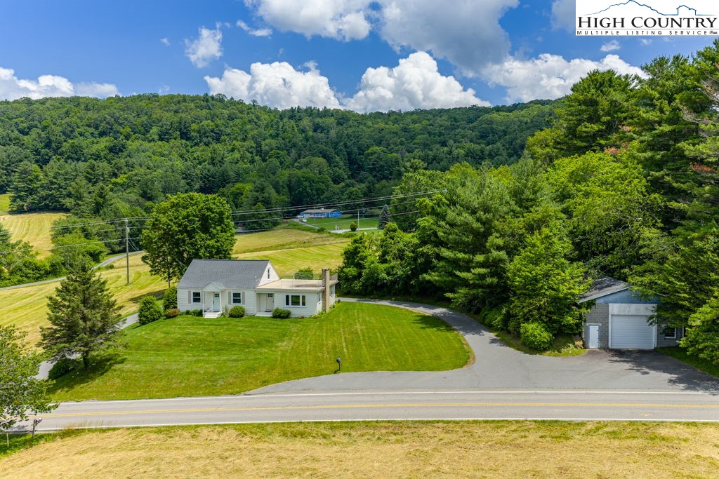 1821 Deerfield Road Boone, NC 28607 - Photo 8 of 33 a view of a swimming pool with a yard