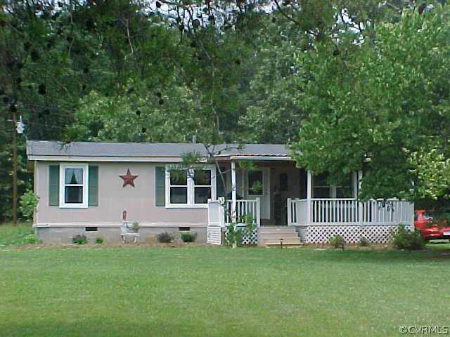 1223 Mt Pleasant Road Pamplin, VA 23958 - Photo 1 of 10 a front view of a house with a garden