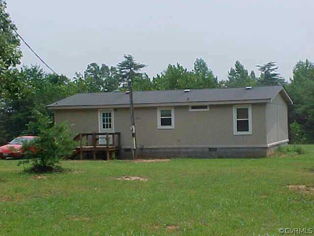 1223 Mt Pleasant Road Pamplin, VA 23958 - Photo 2 of 10 a backyard of a house with table and chairs
