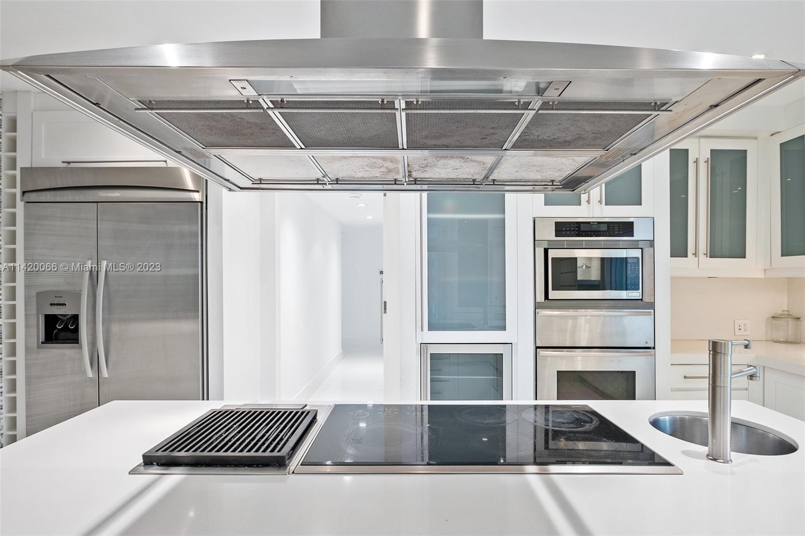 700 Lake Road Miami, FL 33137 - Photo 15 of 59 a view of a refrigerator and microwave