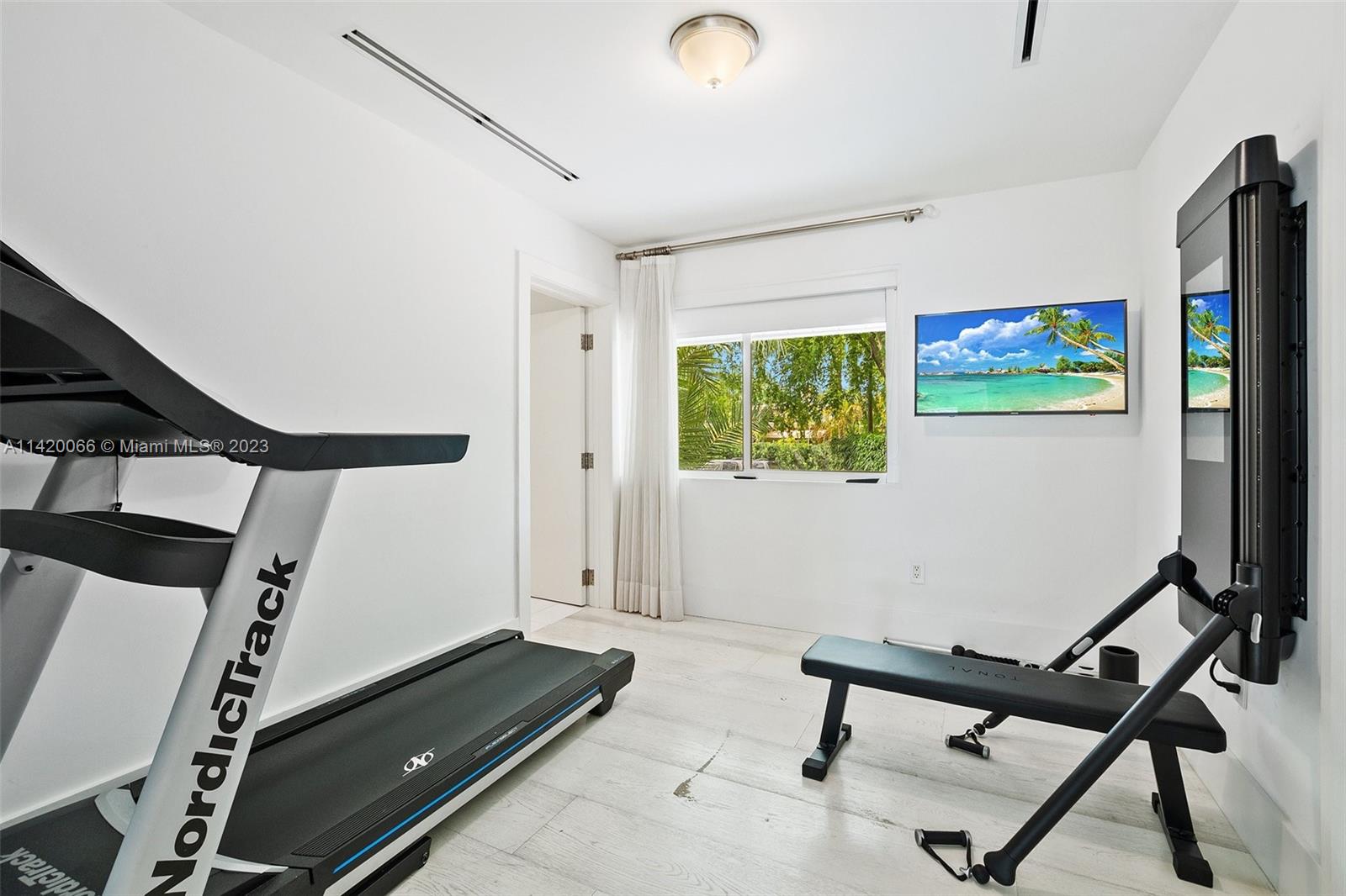 700 Lake Road Miami, FL 33137 - Photo 19 of 59 a view of a room with gym equipment