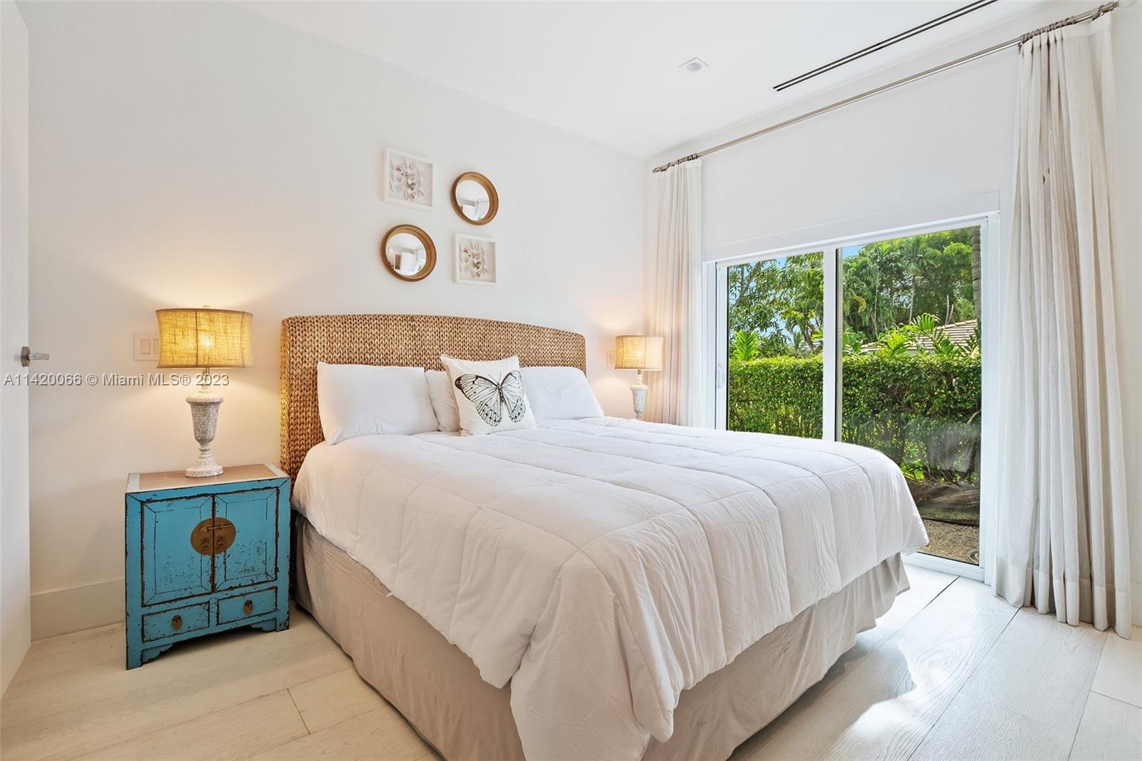 700 Lake Road Miami, FL 33137 - Photo 24 of 59 a bedroom with a bed and a window