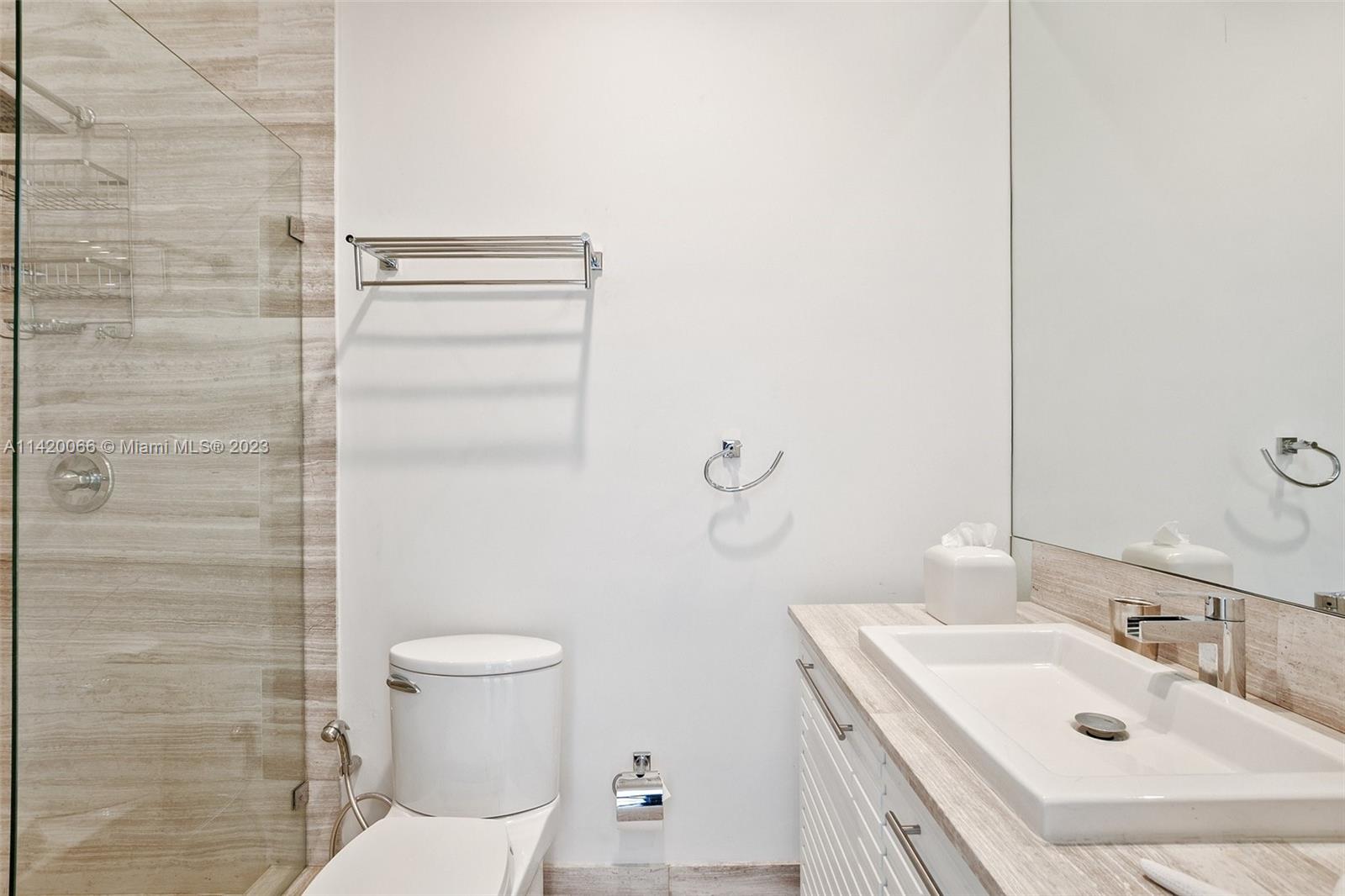 700 Lake Road Miami, FL 33137 - Photo 25 of 59 a bathroom with a sink a toilet and shower