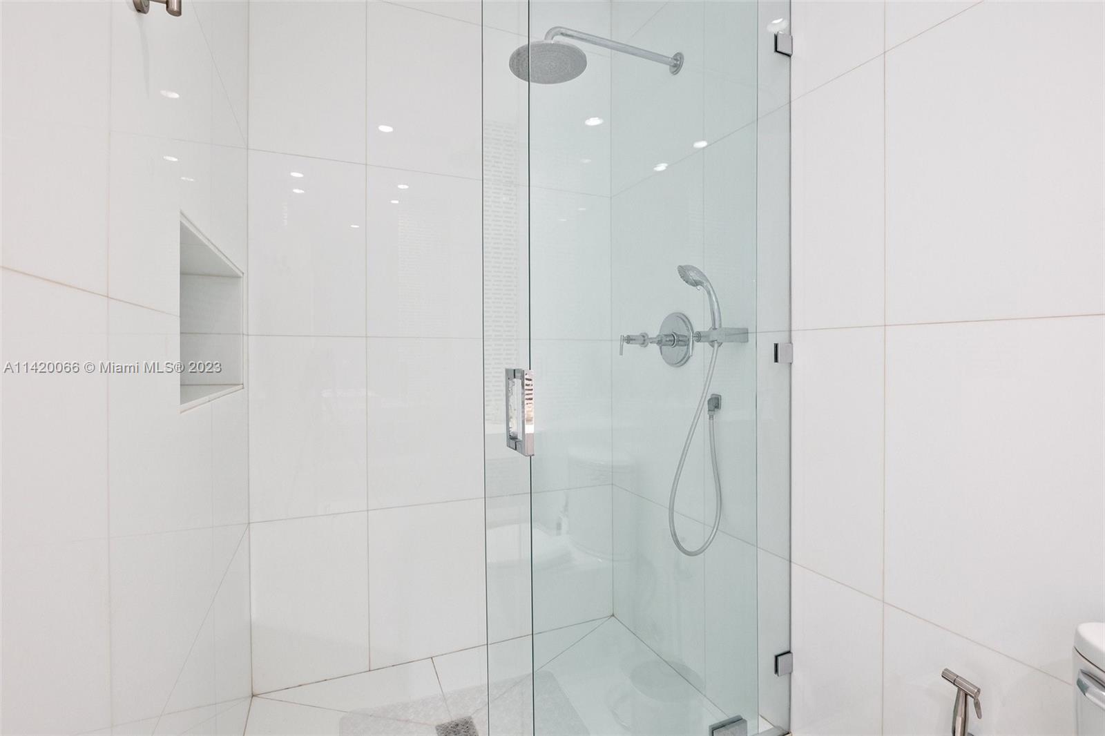 700 Lake Road Miami, FL 33137 - Photo 28 of 59 a bathroom with a shower