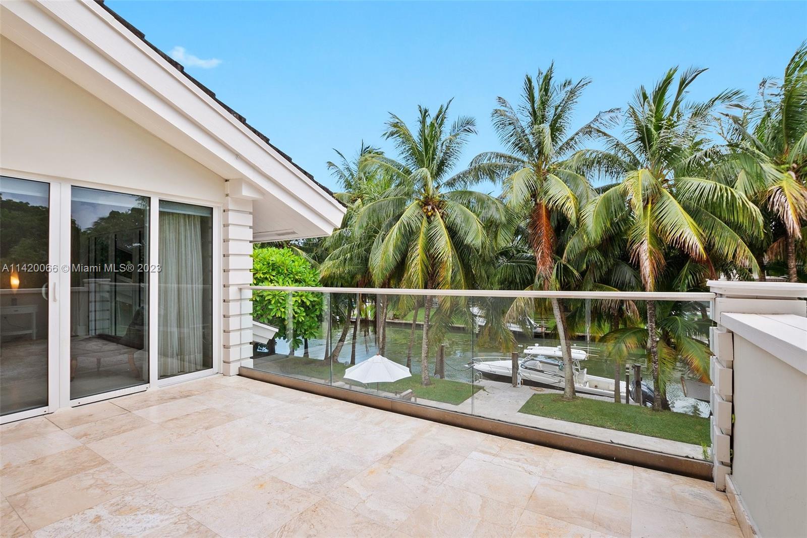700 Lake Road Miami, FL 33137 - Photo 34 of 59 a view of a balcony with lake view and a potted plant