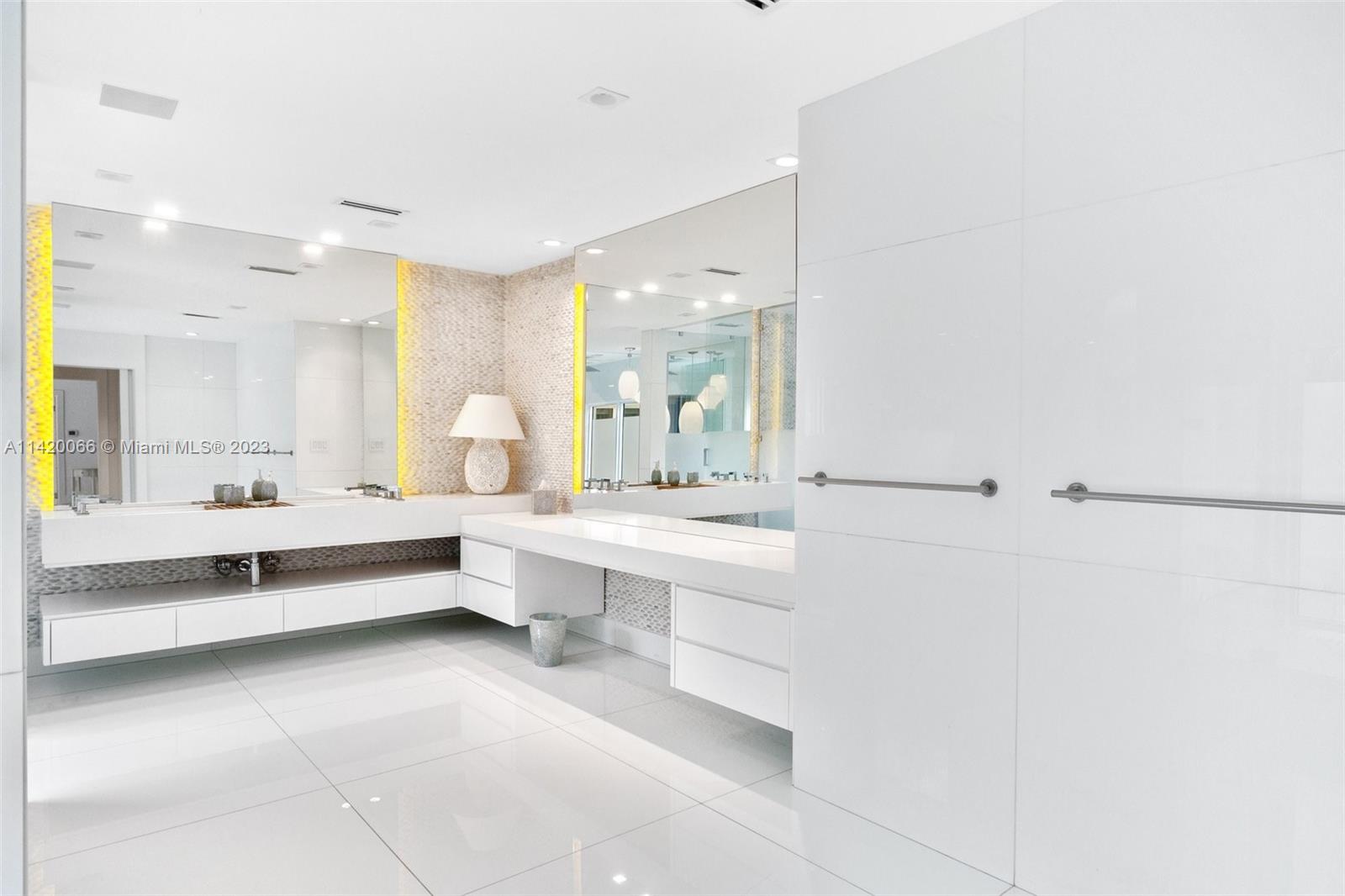 700 Lake Road Miami, FL 33137 - Photo 37 of 59 a large white bathroom with a large tub and sink
