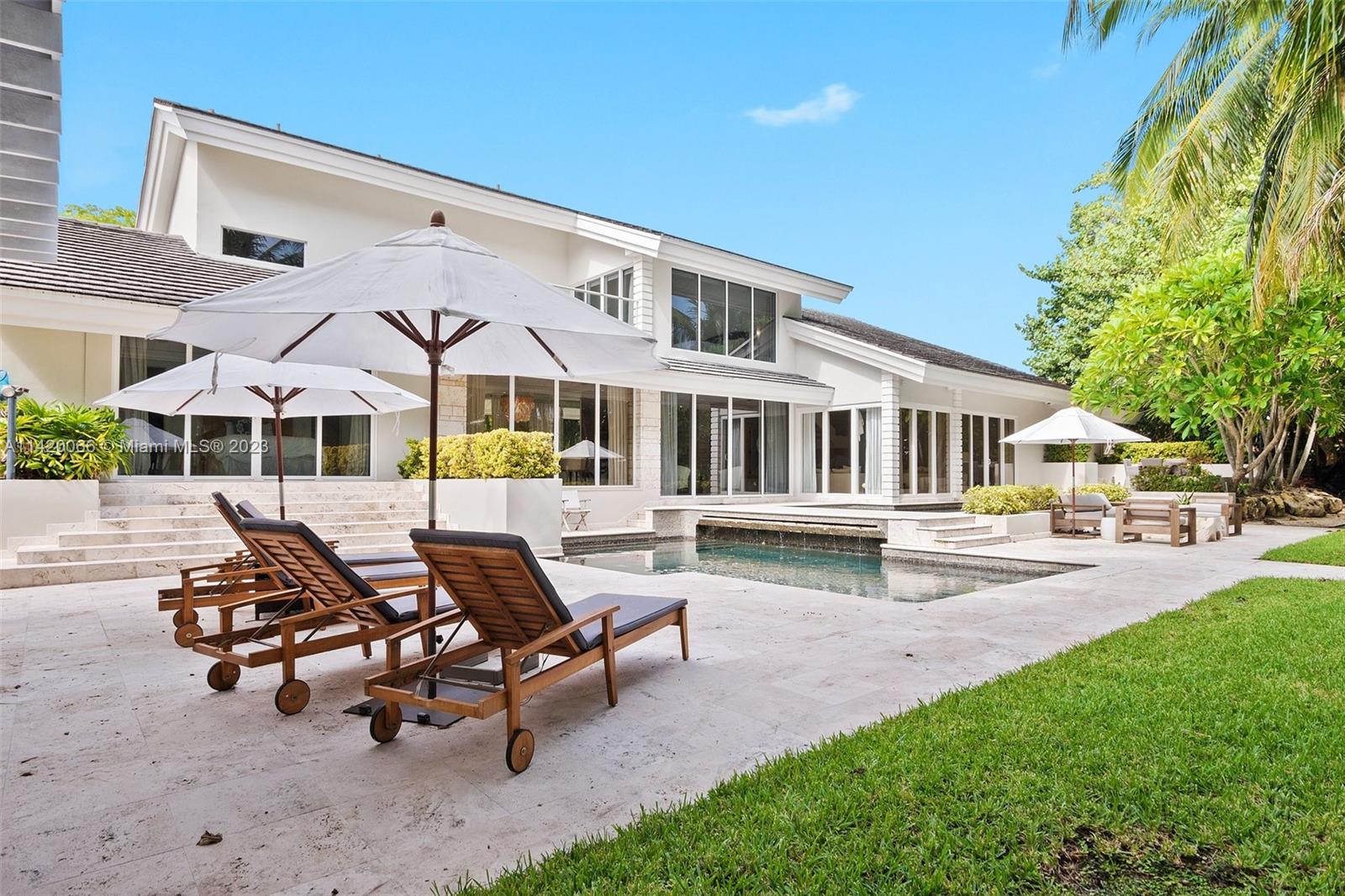 700 Lake Road Miami, FL 33137 - Photo 40 of 59 a view of a house with backyard and sitting area