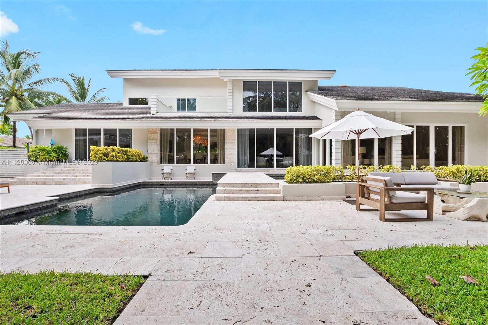 700 Lake Road Miami, FL 33137 - Photo 42 of 59 a front view of a house with a patio