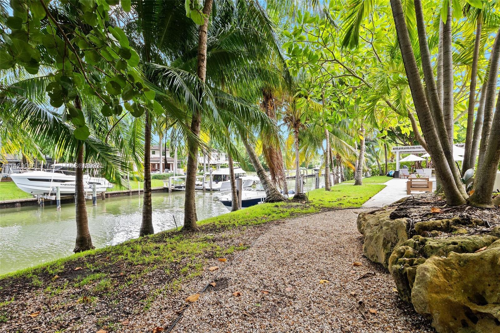 700 Lake Road Miami, FL 33137 - Photo 48 of 59 a view of a lake with large trees