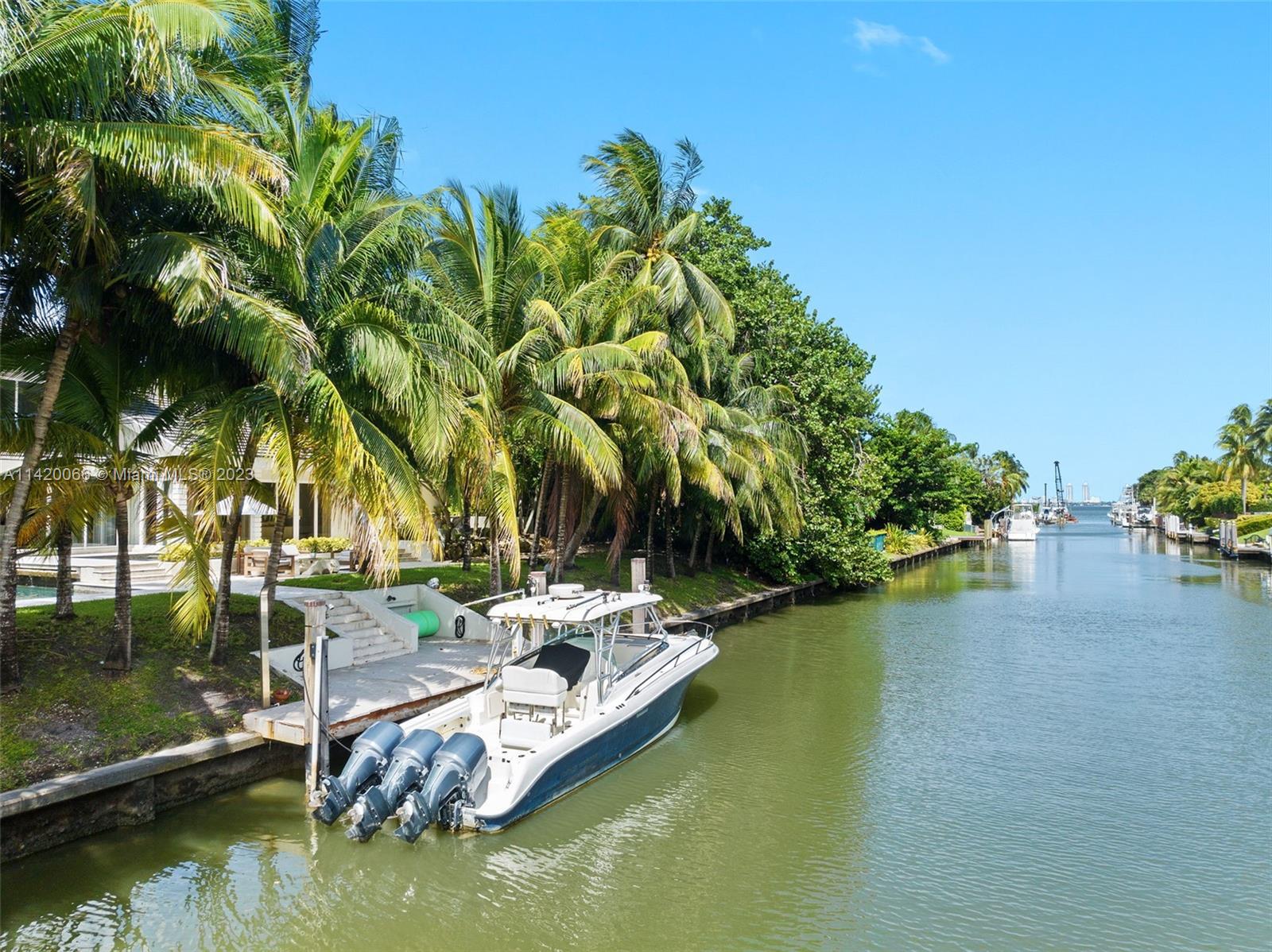 700 Lake Road Miami, FL 33137 - Photo 49 of 59 a view of a lake with couches and city view