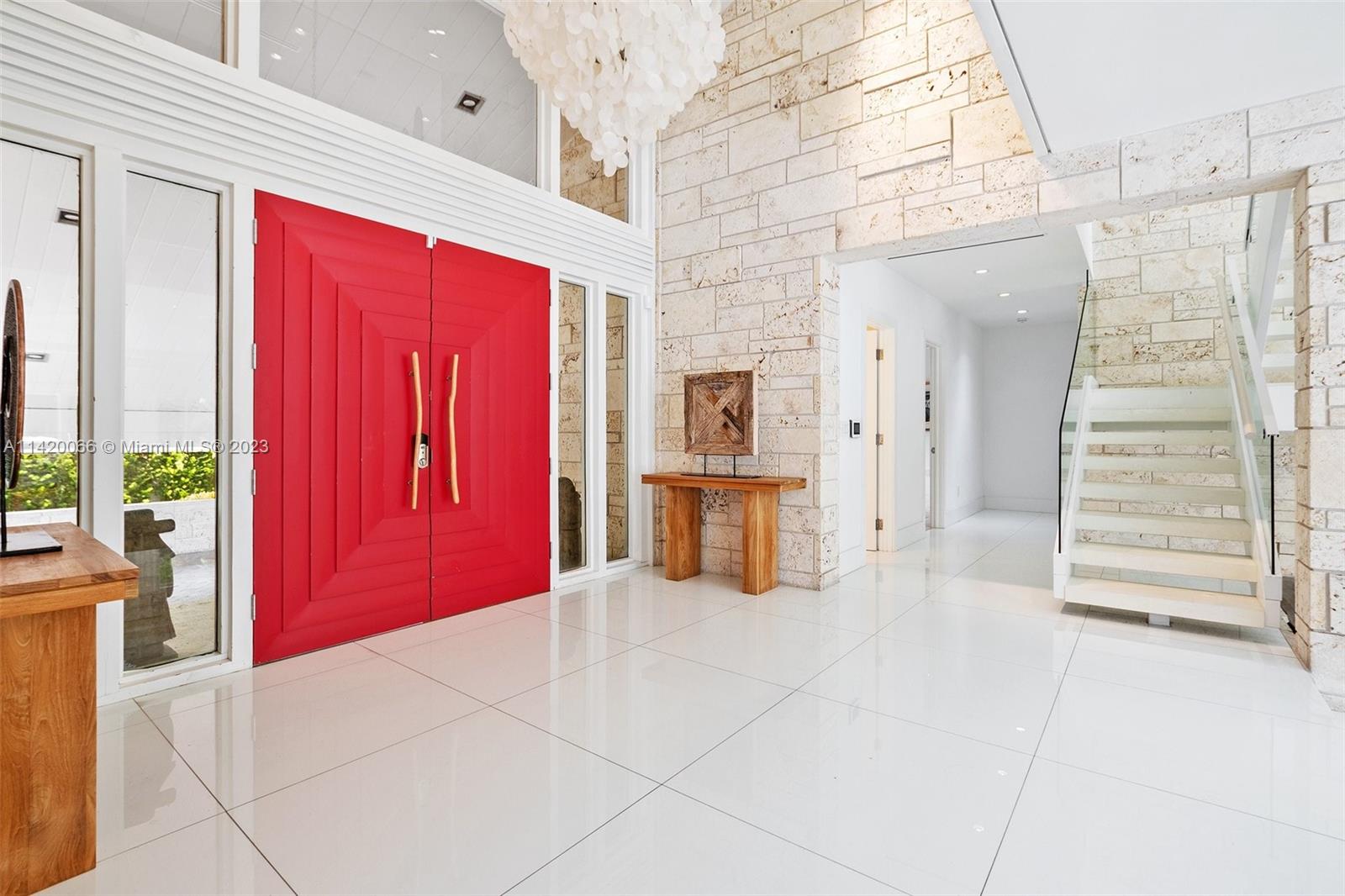 700 Lake Road Miami, FL 33137 - Photo 5 of 59 a view of a hallway with a red stove