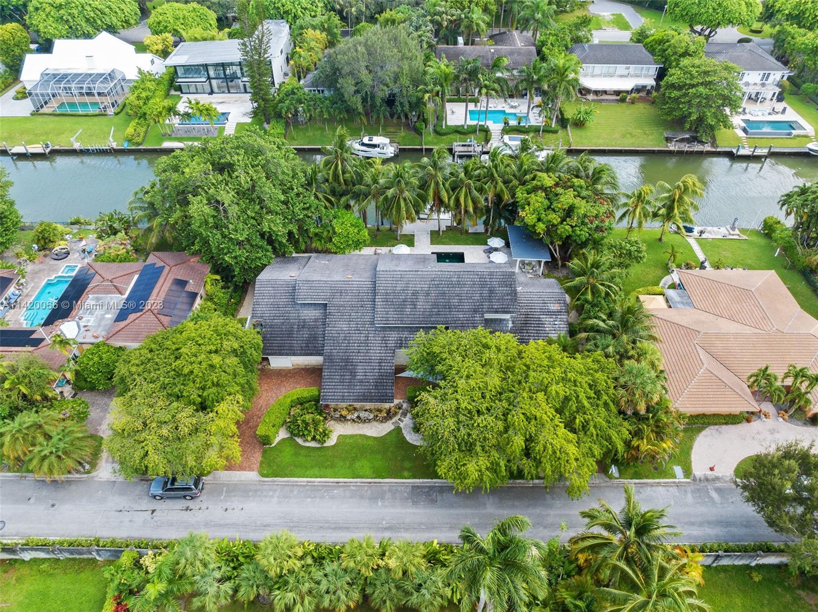 700 Lake Road Miami, FL 33137 - Photo 52 of 59 an aerial view of a house with a garden and a yard