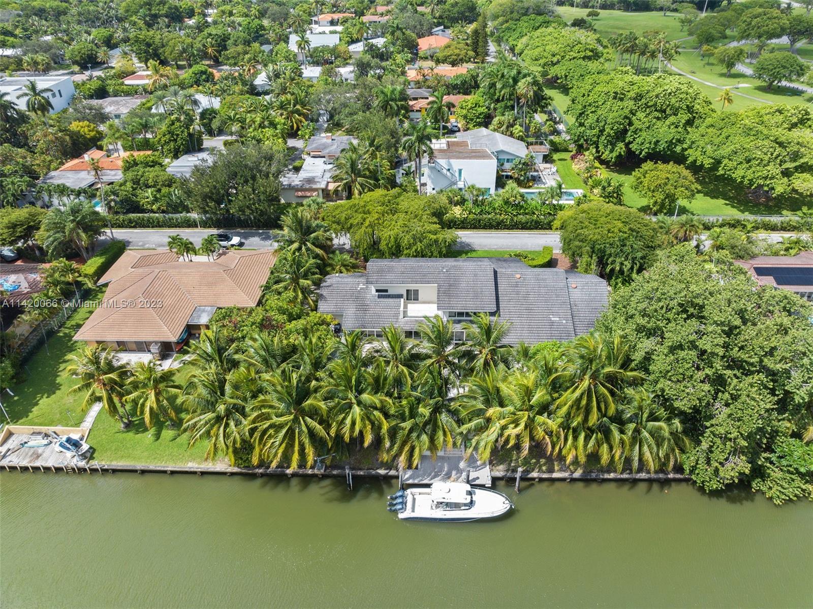 700 Lake Road Miami, FL 33137 - Photo 58 of 59 an aerial view of a house with a garden and lake view