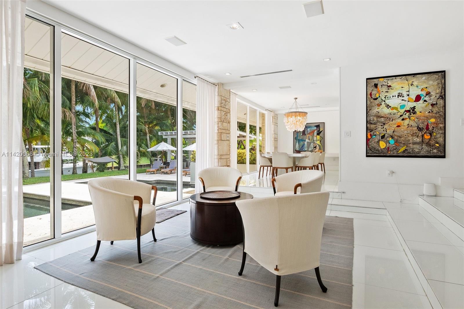 700 Lake Road Miami, FL 33137 - Photo 7 of 59 a living room with a large window and a table