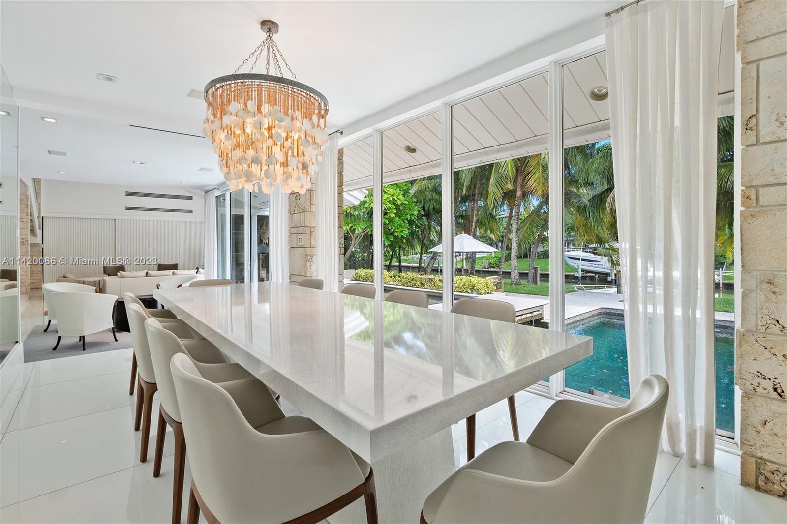 700 Lake Road Miami, FL 33137 - Photo 8 of 59 a view of a dining room with furniture window and outside view