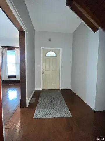 a view of an empty room and yard