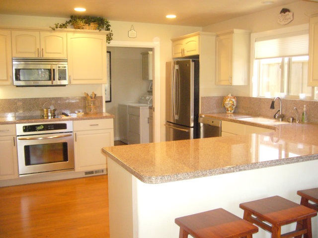 414 Locke Drive Aptos, CA 95003 - Photo 6 of 11 a kitchen with stainless steel appliances granite countertop a sink and a refrigerator
