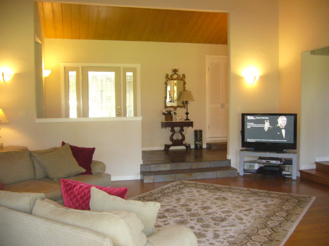 414 Locke Drive Aptos, CA 95003 - Photo 7 of 11 a living room with furniture and a flat screen tv