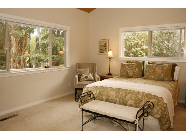 414 Locke Drive Aptos, CA 95003 - Photo 9 of 11 a bedroom with a bed a window and a dresser