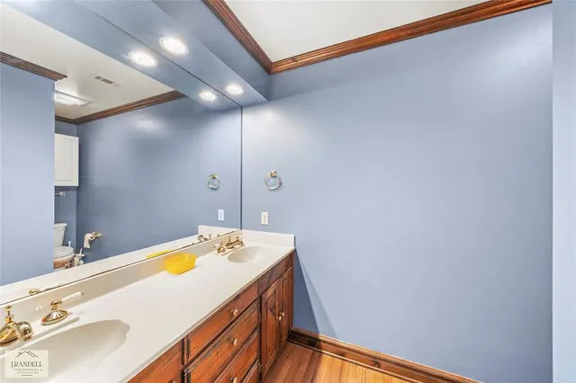 an empty room with an entryway and fan