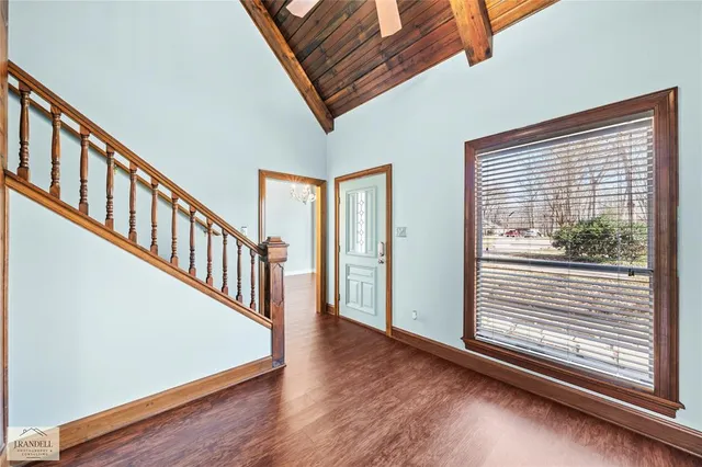 a view of an entryway with wooden floor
