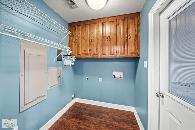 an empty room with a window and a ceiling fan
