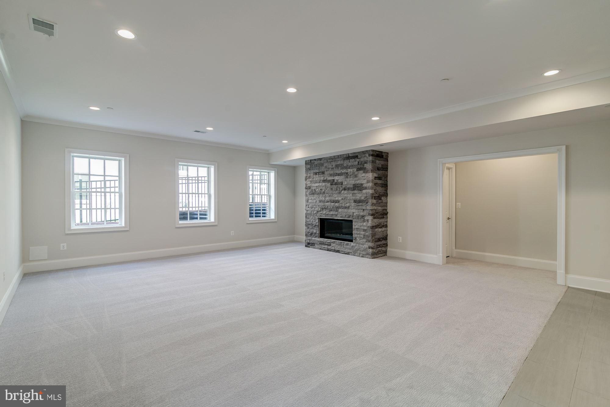 4517 Hoban Road Northwest Washington, DC 20007 - Photo 15 of 16 Lower Level with Fireplace and 10' Ceilings