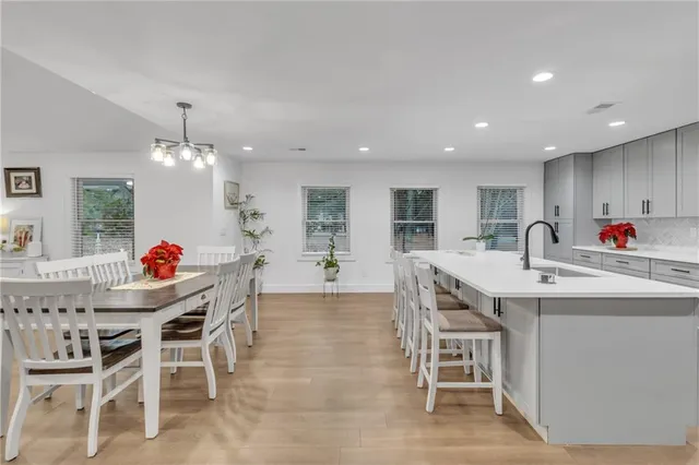 a open kitchen with stainless steel appliances granite countertop a lot of counter space and wooden floor