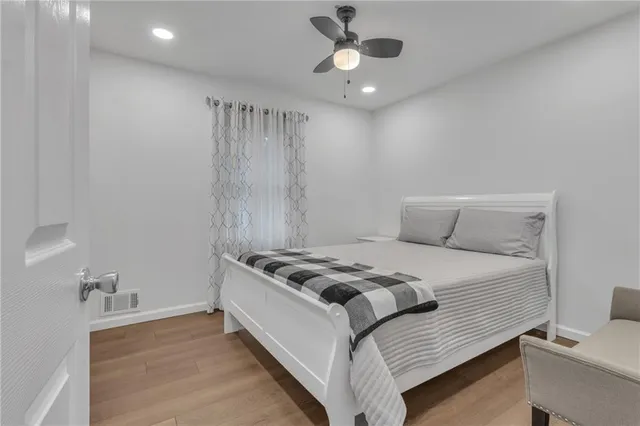 a bedroom with a black and white bed